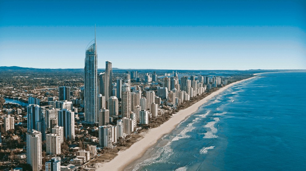 Modern beachside city view with blue skies comparing 1300 vs 1800 numbers