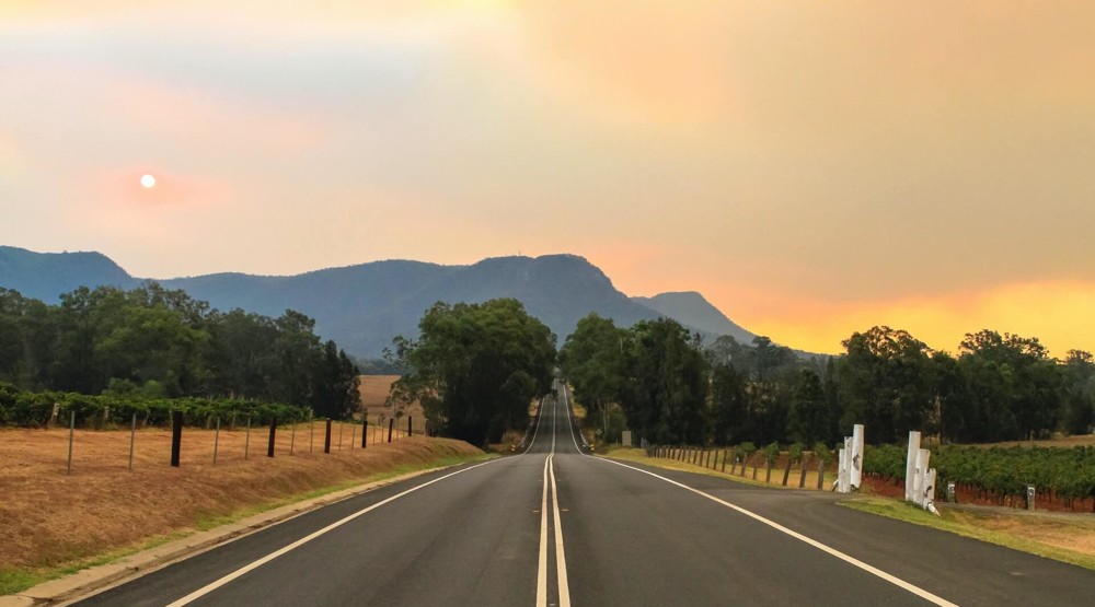 View of an outback Australian road with red dust sky because 1300 phone numbers can be used anywhere your business operates